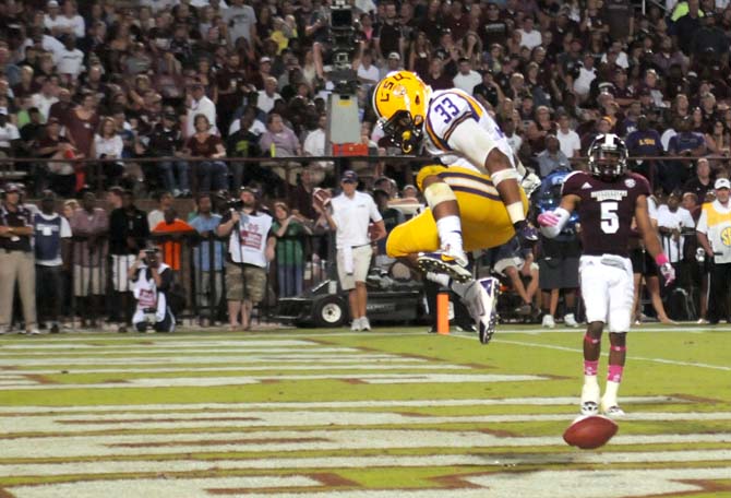 LSU sophomore running back Jeremy Hill (33) leaps in the air in celebration right after he scores a touchdown on Saturday October 5, 2013 during the 59-26 victory against Mississippi State.