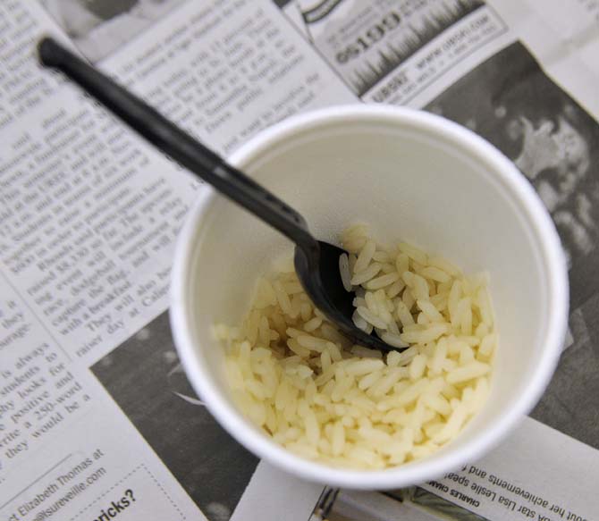 LSU students and families from around Baton Rouge were randomly selected to live like a lower class person at the 2013 Oxfam Hunger Banquet Wednesday, Oct. 23, 2013 in the Student Union. The lower class was served rice as their meal.