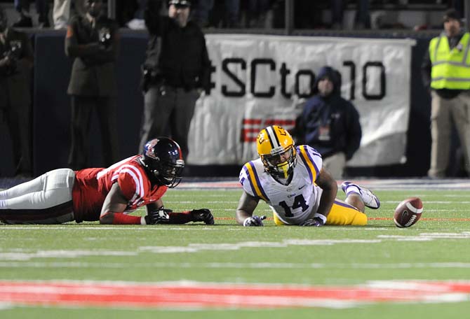 LSU junior running back Terrence Magee (14) misses a pass Saturday, October 19, 2013 during the Tigers' 27-24 loss against Ole Miss at Vaught-Hemingway Stadium.