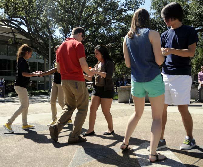 The Hispanic Student Cultural Society promotes Hispanic Heritage Month by offering Salsa dance lessons Wednesday, Oct. 9, 2013, in the Echo Circle of Free Speech Alley.