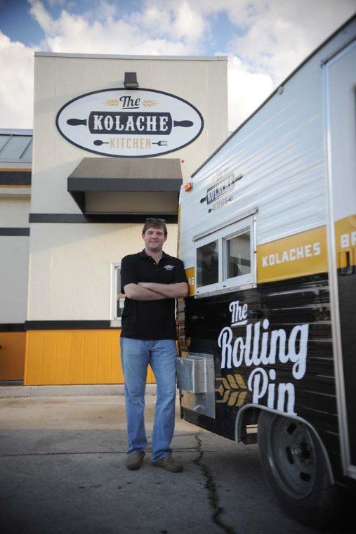 Owner and Operator Will Edwards stands Sunday, Oct. 27, 2013 with their new food truck "The Rolling Pin".