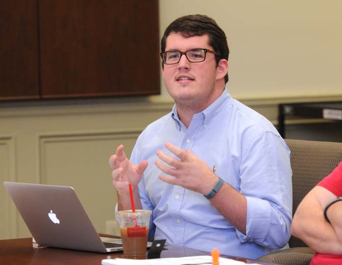 Graduate college council president Thomas Rogers discusses the student technology fee Monday, October 21, 2013, at a meeting in Thomas D. Boyd Hall.