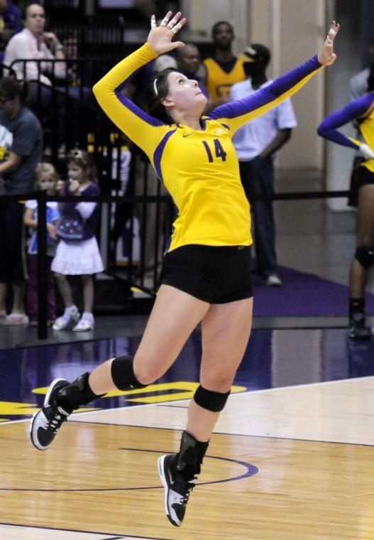 Junior setter Malorie Pardo (14) serves the ball Saturday, Oct. 5, 2013 in the Pete Maravich Assembly Center.