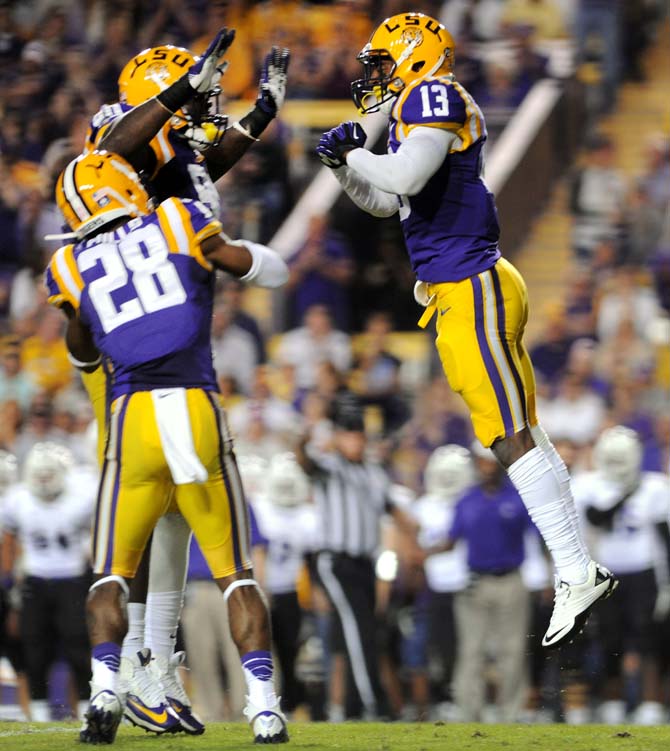 LSU freshman corner back Dwayne Thomas (13) celebrates after a play Saturday, Oct. 26, 2013, during the Tigers' 48-16 win against Furman in Tiger Stadium.