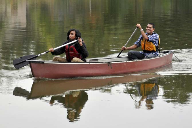 Janay Thomas (left) and De'Marcus Goins, students from Scotlandville Magnet High School, paddle to the shore after an afternoon on the LSU Campus Lakes on Monday, Oct. 21, 2013, at the BREC Milford Wampold Memorial Park on Stanford Ave. They are a part of the LSU EnvironMentors program.