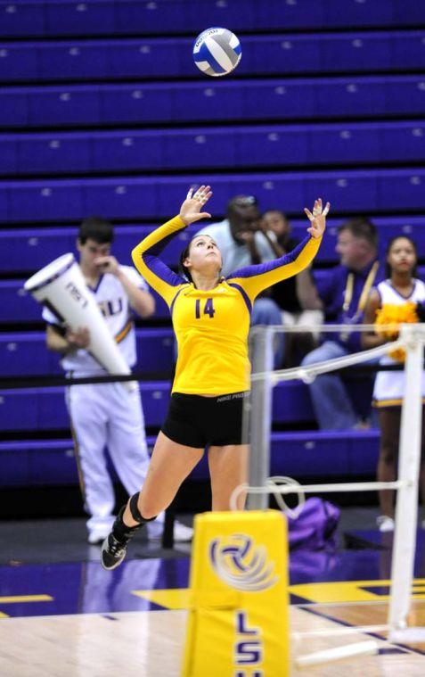 LSU junior setter Malorie Pardo (14) prepares to serve the ball Sunday, Oct. 13, 2013 during the Tigers' victory against Mississippi State in the PMAC.