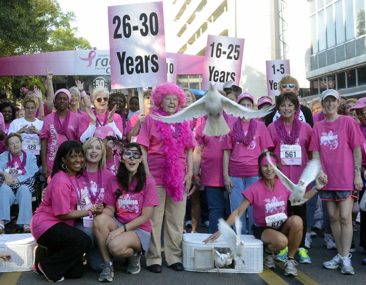 Cancer survivors release doves before the Susan G. Komen North Central Alabama Race for the Cure for breast cancer in downtown Birmingham, Ala., Saturday, Oct. 12, 2013. (AP Photo/ AL.com, Mark Almond)