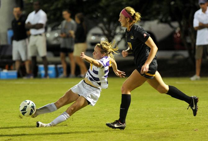 LSU freshman midfielder Emma Fletcher (8) crosses the ball into the box Friday, Oct. 11, 2013 during the 1-0 victory against Mizzou at LSU Soccer Stadium.