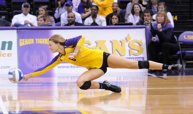 LSU junior outside hitter Helen Boyle (8) dives for the ball Sunday, October 27, 2013 during the Tigers' 3-2 victory against Arkansas at the PMAC