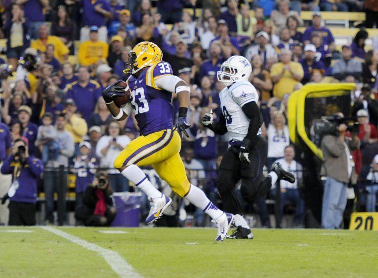 LSU sophomore running back Jeremy Hill (33) runs the ball downfield Saturday night, Oct. 26, 2013 during the Tigers' 48-16 win against Furman in Tiger Stadium.