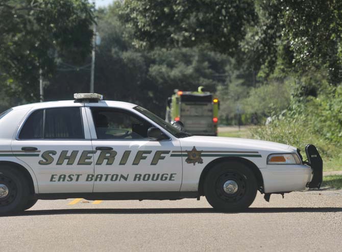 East Baton Rouge Sheriffs shut down Highland Road between Siegen Lane and Amiss Road on Wednesday, October 9, 2013 due to the threat of a grenade found at a house.