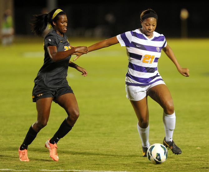 LSU senior defender Nina Anderson (21) fights for control of the ball Friday, Oct. 11, 2013 during the 1-0 victory against Mizzou at LSU Soccer Stadium.