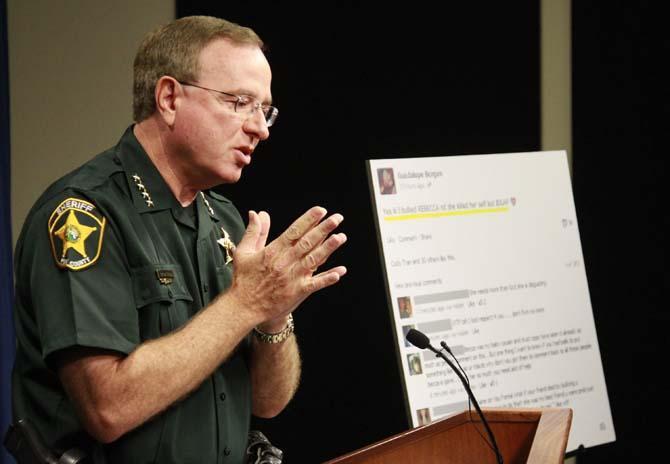 Polk County Sheriff Grady Judd talks about the events leading up to the arrest over the weekend of two juvenile girls in a Florida bullying case at a press conference in Winter Haven, Fla., Monday, Oct. 15, 2013. Two middle school girls ages 14 and 12 have been arrested and charged with felony aggravated stalking in connection with the suicide earlier this year of 12-year-old Rebecca Ann Sedwick in Lakeland. Judd said police arrested the 14-year-old girl after she posted online Saturday that she bullied Rebecca and she didn't care. The 12-year-old girl was Rebecca's former best friend, but Judd said the 14-year-old girl turned her against Rebecca. (AP Photo/The Ledger, Calvin Knight) TAMPA TRIBUNE OUT