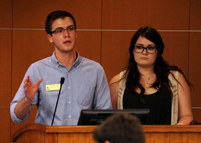 Speaker pro tempore Trey Schwartenzburg and Senator Kayleigh Buvens propose a resolution to bring to the Faculty Senate opposing the implementation of a suffix grading system at LSU on Wednesday, Oct. 9, 2013, in the Capitol Chambers Room.