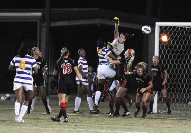 LSU junior defender and midfielder Jodi Calloway (10) and GA senior goalkeeper (1) battle for the ball Friday, Oct. 25, 2013 during the Tigers' loss againt Georgia 2-1