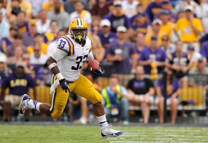 LSU sophomore running back Jeremy Hill rushes toward the first down Saturday, Oct. 12, 2013 during the Tigers' 17-6 victory against the Florida Gators in Tiger Stadium.