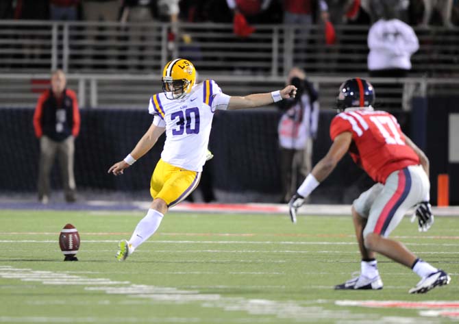 LSU junior place kicker James Hairston (30) punts the ball Saturday, October 19, 2013 during the Tigers' 27-24 loss against Ole Miss at Vaught-Hemingway Stadium.