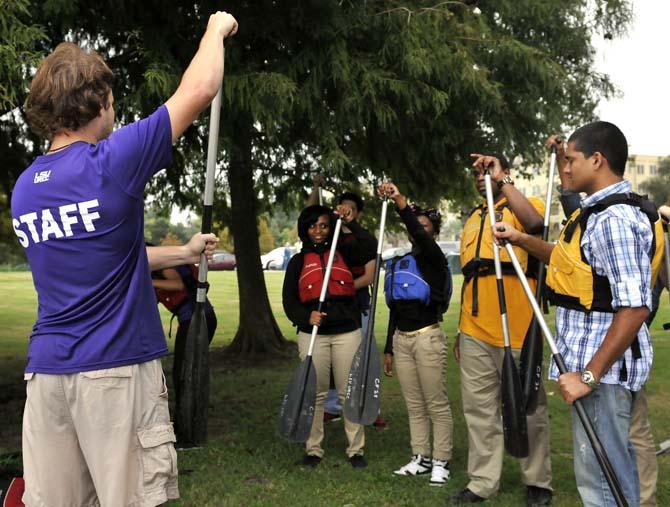 Staff from the LSU UREC and members of the LSU chapter of the Environmentors collaborate with students from Scotlandville High for a canoeing field trip and to elaborate on their science projects Monday, Oct. 21, 2013, at the BREC Milford Wampold Memorial Park on Stanford Ave.