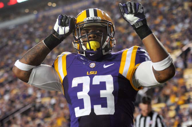 LSU sophomore running back Jeremy Hill (33) celebrates after a touchdown Saturday, Oct. 26, 2013 during the Tigers' 48-16 win against Furman.