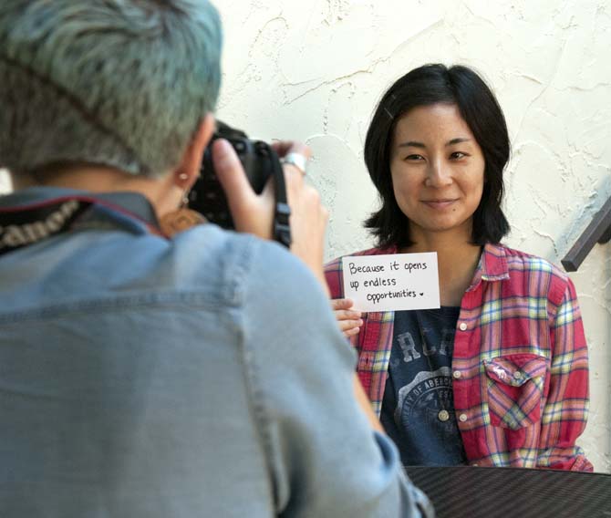 LSU phsycology junior Courtney Brandabur takes a picture of Shoko Morikawa Wednesday, Oct. 9, 2013 for her opinoin on feminsism for her upcoming documentary on equality when it comes to education around the world.