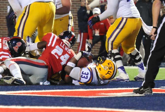 Sophomore running back Jeremy Hill (33) scores a touchdown Saturday, October 19, 2013 during the Tigers' 27-24 loss against Ole Miss at Vaught-Hemingway Stadium.