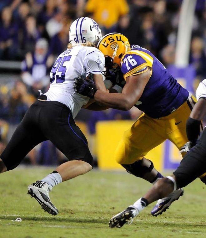 LSU freshman offensive lineman Josh Boutte (76) tackles a Furman defender Saturday, Oct. 26, 2013, during the Tigers' 48-16 win against Furman in Tiger Stadium.