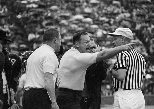 University of Michigan head football coach, Schembechler got his dander up after an illegal substitution call during the second quarter of Saturday's Michigan-Purdue game in Ann Arbor, Michigan, Oct. 13, 1969. At one point, Schembechler walked along the sidelines to the ten yard line shouting at the officials in an effort to sound off at the injustice. Also shown is defensive coach Bill Young. (AP Photo)