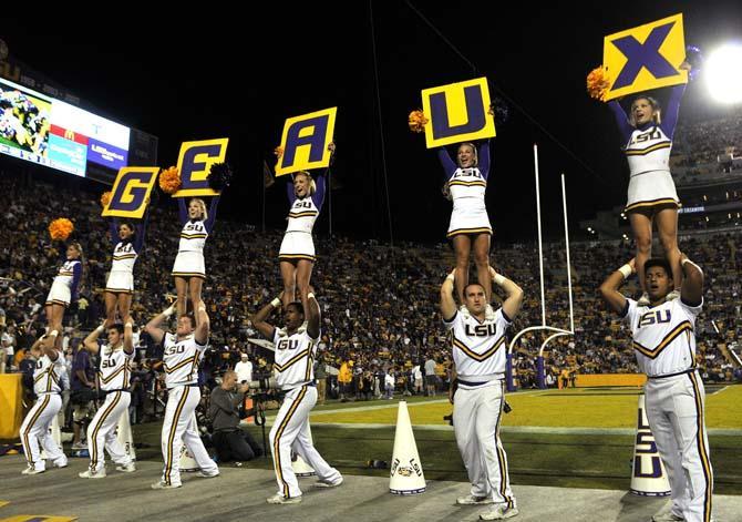 LSU cheerleaders pump up the student section Saturday, Oct. 26, 2013, during the Tigers' 48-16 win against Furman in Tiger Stadium.