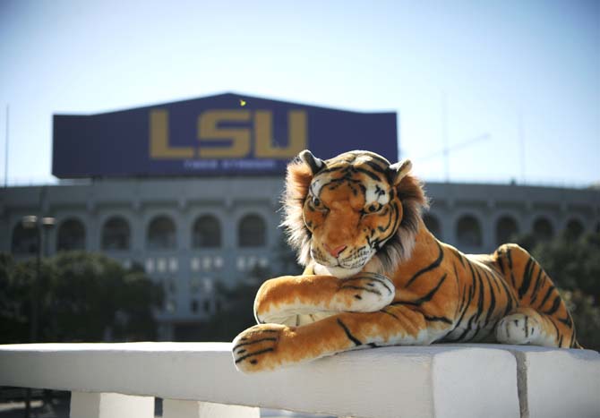 Inspired by Unagi Travels, a stuffed tiger is photographed Monday, Oct. 28, 2013 lounging in front of the LSU Tiger Stadium.