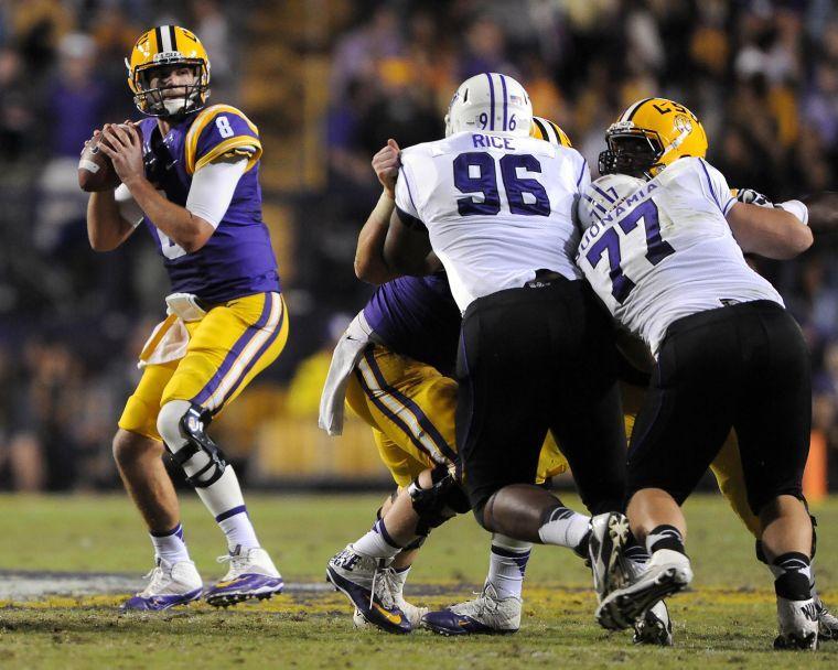 LSU senior quarter back Zach Mettenberger (8) scans the field Saturday night, Oct. 26, 2013 during the Tigers' 48-16 win against Furman in Tiger Stadium.