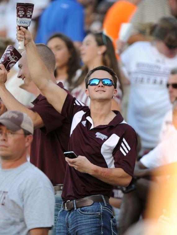 A Mississippi State fan shakes his cowbell on Saturday Oct. 5, 2013 during the 59-26 victory game against Mississippi State in Davis Wade Stadium. The shaking of the cow bells is a Mississippi State football game tradition originating from a cow wandering onto the field during a game in the early 1900s.