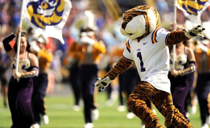 LSU mascot Mike the Tiger runs across the field Saturday, Oct. 12, 2013 during pregame festivities before the Tigers' 17-6 victory against the Gators in Tiger Stadium.