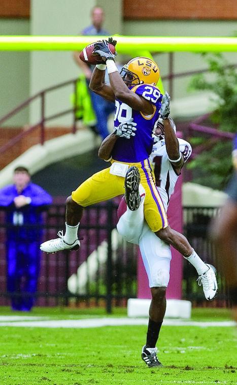 Senior corner back Chris Hawkins (29) intercepts a pass from Mississippi State senior quarterback Tyson Lee intended for Mississippi State freshman wide receiver O'Neal Wilder (81) Saturday morning in Davis Wade Stadium in Starkville. LSU defeated MSU 30 to 26.