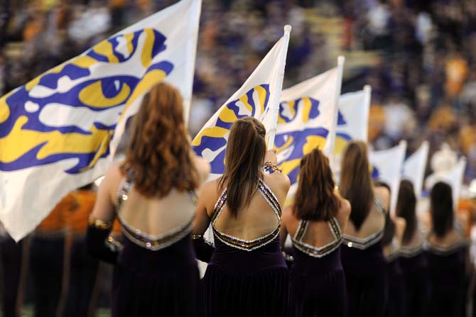 LSU Colorguard members fly the tiger eye flags Saturday, Oct. 26, 2013, during the Tigers' 48-16 win against Furman in Tiger Stadium.