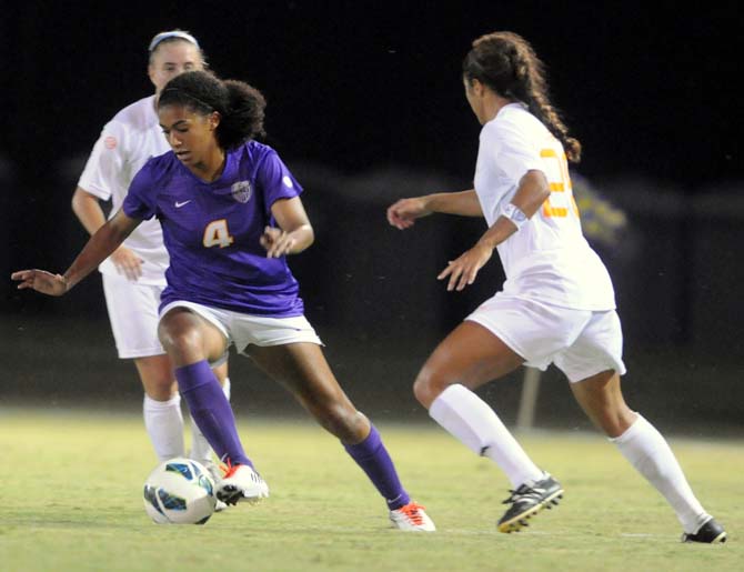 Freshman forward Summer Clarke (4) weaves between University of Tennessee players Friday, Sept. 27, 2013 at the LSU Soccer Stadium.