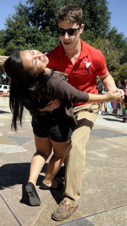 The Hispanic Student Cultural Society promotes Hispanic Heritage Month by offering Salsa dance lessons Wednesday, Oct. 9, 2013, in the Echo Circle of Free Speech Alley.