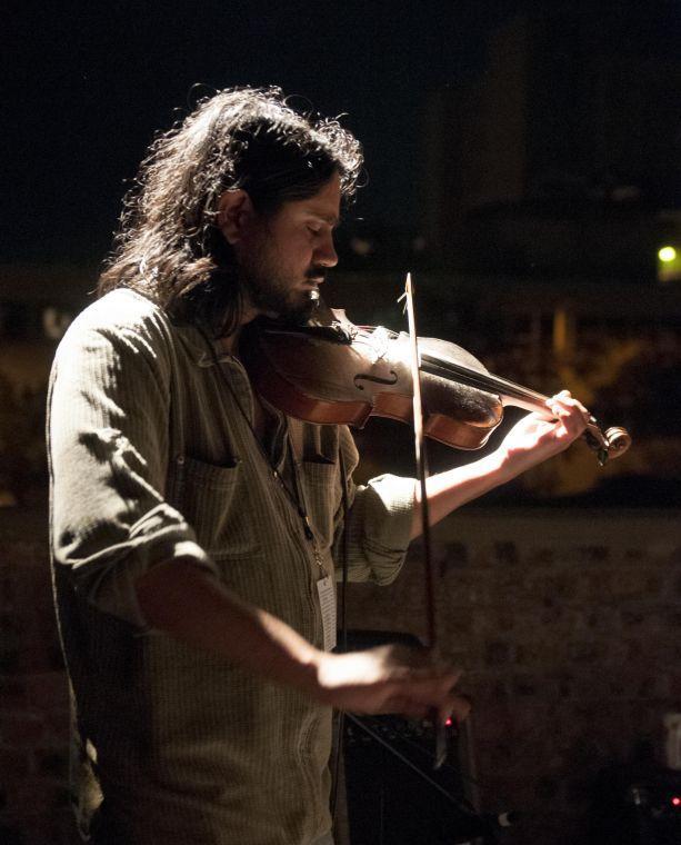 John Fernandez of Party Party Partners plays violin Friday night, Oct. 11, 2013 at MSPSNMF in Shreveport, Louisiana.