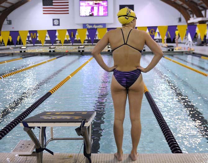 LSU senior Laura Furr stands next to the pool waiting to jump in for the women's 100 yard backstroke event on Friday October 18, 2013 at the LSU vs. Georgia swim meet in the Natatorium.