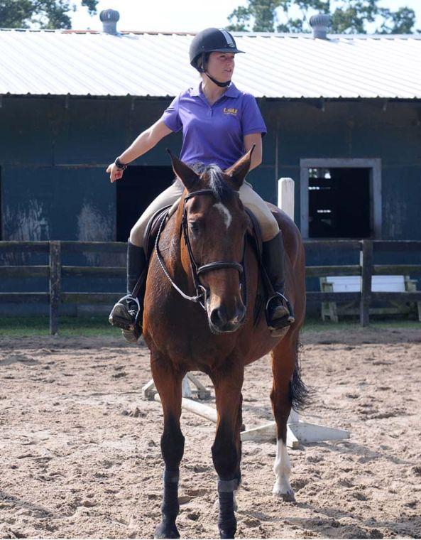 LSU equestrian coach Leaf Boswell instructs some girls during their practice on Sunday October 13, 2013 at Ravenwood Stables in Prairieville.