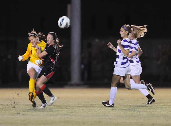 LSU senior goalkeeper Megan Kinneman (1) collides with GA freshman forward Marion Crowder (16) Friday, Oct. 25, 2013 as they compete for posession during the Tigers' loss 2-1