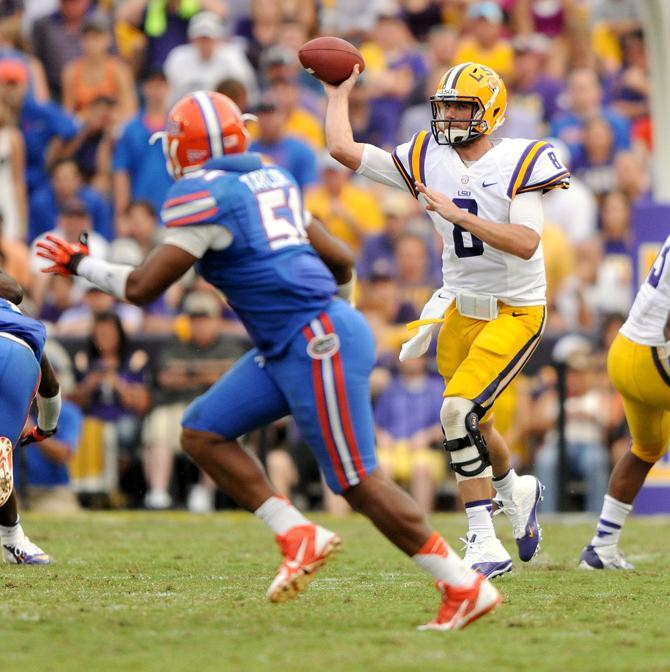 LSU senior quarterback Zach Mettenberger (8) attempts a pass Saturday, Oct. 12, 2013 during the Tigers' 17-6 victory against the Florida Gators in Tiger Stadium.