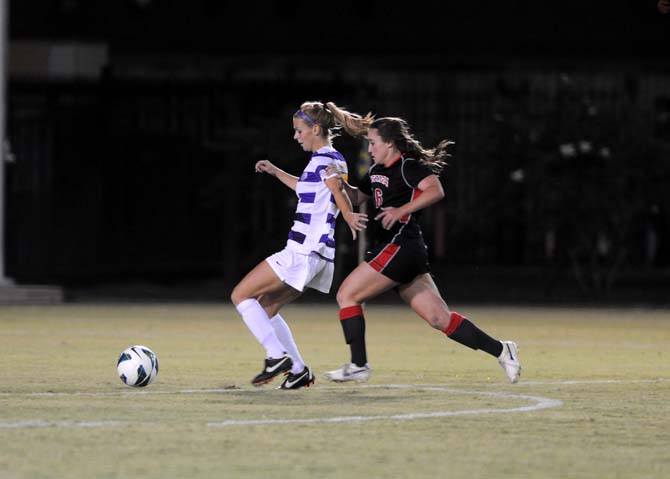 LSU senior defender Addie Eggleston and Georgia freshman forward Marion Crowder battle for the ball Friday, Oct. 25, 2013 during the Tigers' 2-1 loss.
