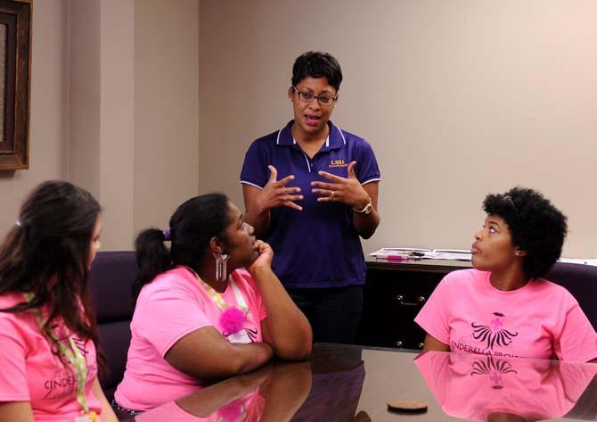 Center For Freshman Year academic counselor Erin Anthony speaks to a group of high school girls about planning their futures and their ability to get the most out of their college careers on Friday October 4, 2013 in 150 Allen Hall.