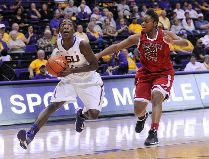 LSU freshman guard Raigyne Moncrief (11) drives past Tennessee Temple sophomore guard Bree Smith (24) on Wednesday, Oct. 30, 2013 during the Lady Tiger's 95-24 victory agianst Tennessee Temple in the PMAC.