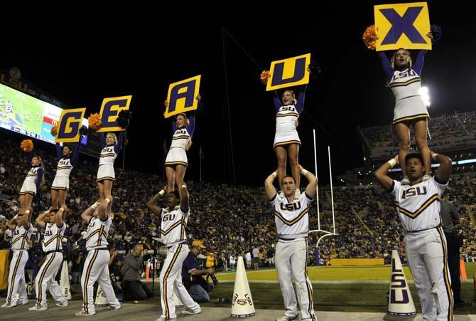 LSU cheerleaders pump up the student section Saturday, Oct. 26, 2013, during the Tigers' 48-16 win against Furman in Tiger Stadium.