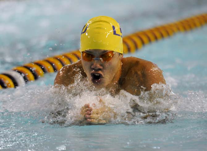 LSU sophomore Gabe Rooker takes a breath during the men's 100 yard breaststroke event on Friday October 18, 2013 at the LSU vs. Georgia swim meet in the Natatorium.