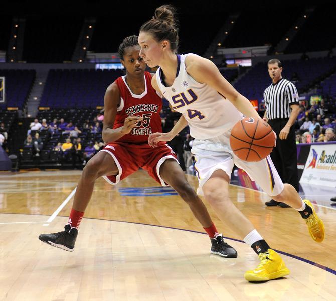 LSU sophomore guard Anne Pedersen (4) drives toward the goal Wednesday, Oct. 30, 2013 during the Lady Tiger's 95-24 victory agianst Tennessee Temple in the PMAC.