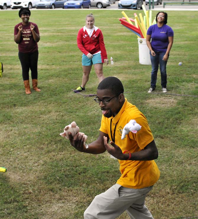 Cedric Taylor, a student from Scotlandville Magnet High School, juggles stuffed animals during an Ice Breaker game at the LSU EnvironMentors program event on Monday, Oct. 21, 2013, at the BREC Milford Wampold Memorial Park on Stanford Ave.