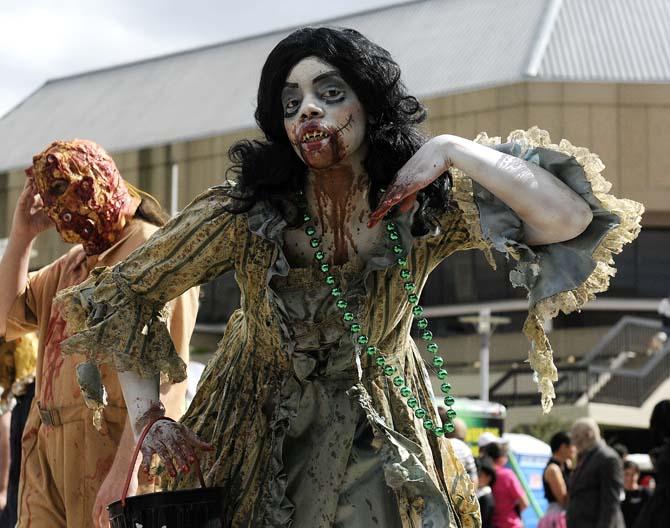 A lady in costume poses during the 10/31 Consortium's Halloween Parade on Saturday, Oct. 19, 2013 in downtown Baton Rouge.