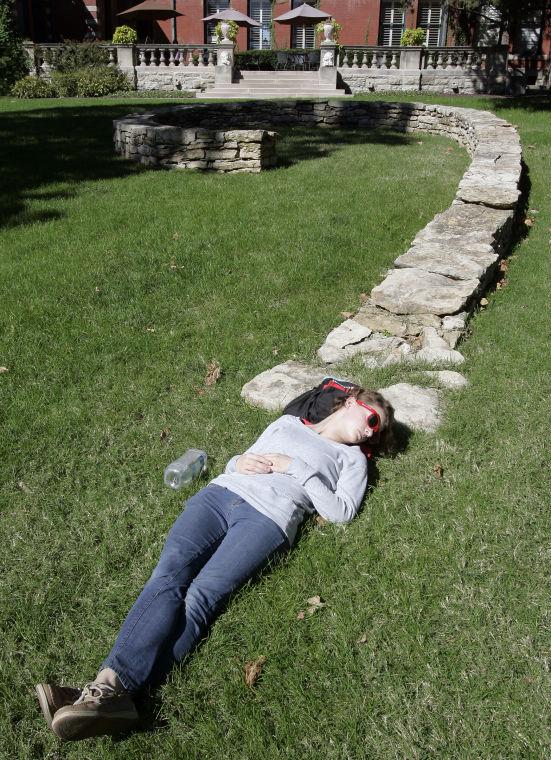 Sophomore illustration student, Rachel Bryant of Mission, Kan., grabs a quick nap between classes on the concourse at Kansas City Art Institute on Wednesday, Oct. 9, 2013 in Kansas City, Mo. (AP Photo/The Kansas City Star, Jim Barcus)